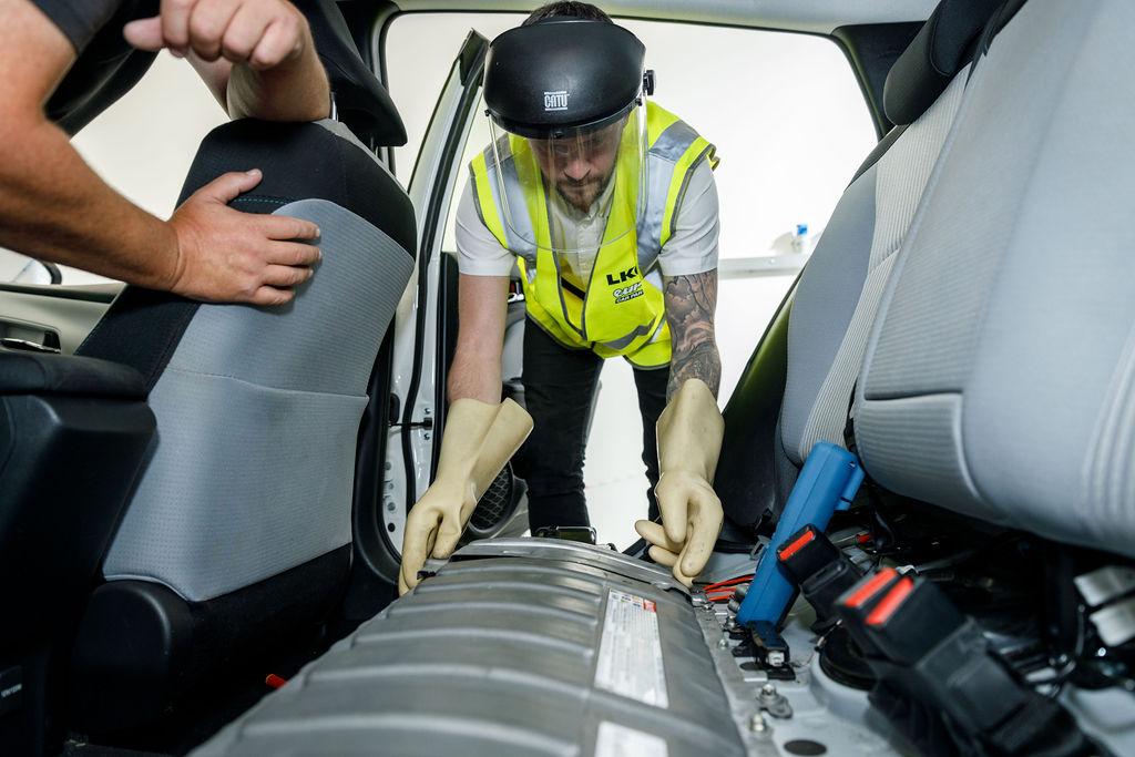 Man inspecting interior of vehicle